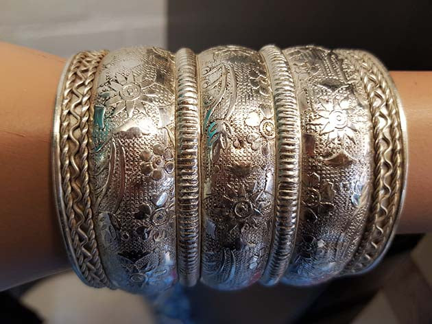 Edited wide silver-colored bracelet