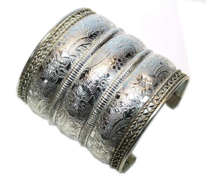 Edited wide silver-colored bracelet