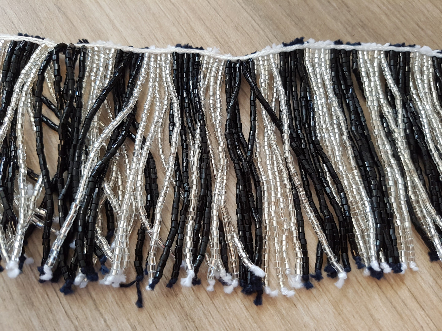 Beaded string with black/white strings