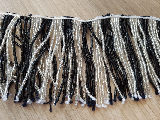 Beaded string with black/white strings