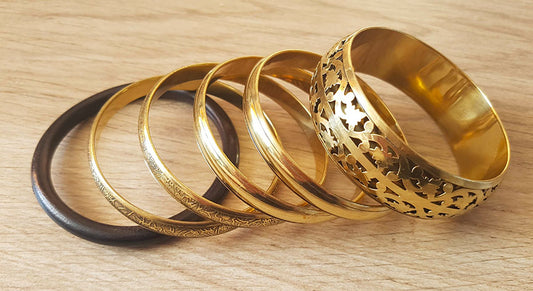 Set of gold colored bracelets 