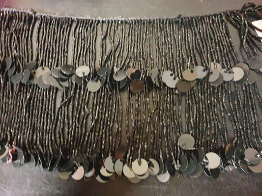 Beaded string with strings of black beads