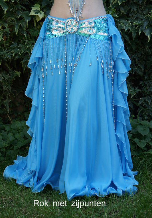 Beautiful skirt in turquoise with strips and slits on the sides and 2 layers of fabric.