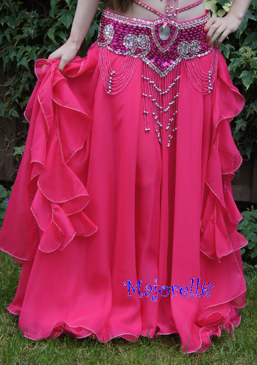 Nice skirt in fuchsia with strips and slits on the side and 2 layers of fabric.