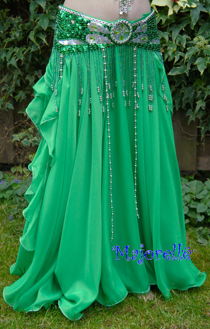 Green skirt with ruffles on the side. With slits on the sides