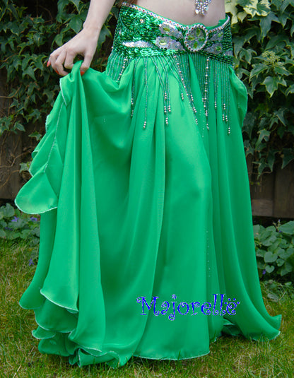 Green skirt with ruffles on the side. With slits on the sides