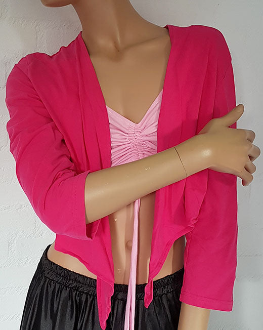 Belly dance top in fuchsia with three-quarter sleeves.