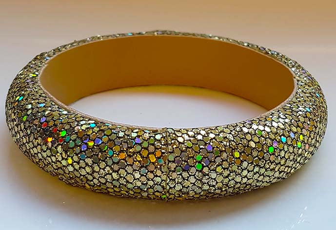 Gold colored glitter bracelet