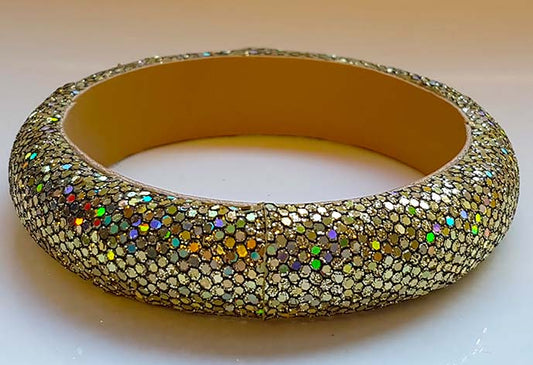 Gold colored glitter bracelet