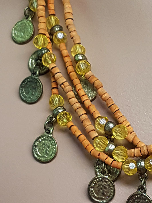 Beautiful necklace with soft orange beads and old coins