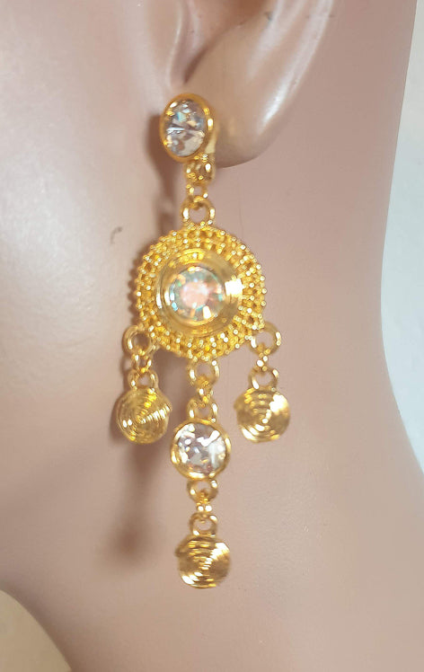 Beautiful gold-colored earrings, stud earrings.