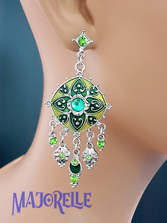 Silver-colored earrings with green star and rhinestones