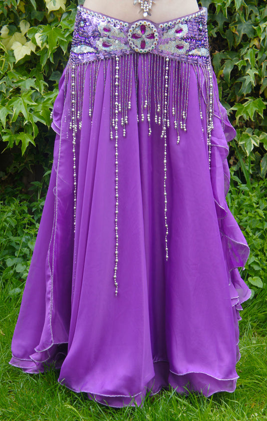 Beautiful purple skirt with strips on the side. With slits on the sides 2 layers of fabric.