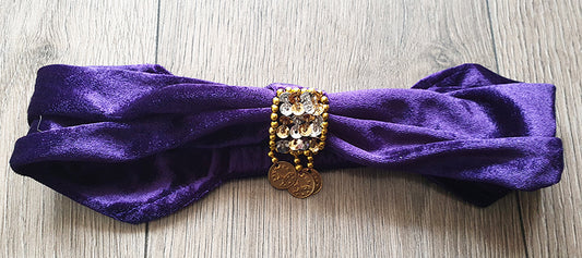purple headband decorated with beads