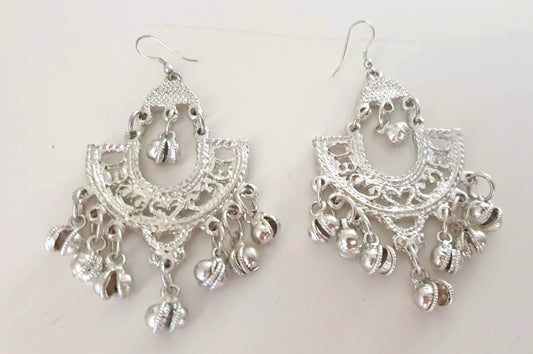 Silver colored earrings with bells