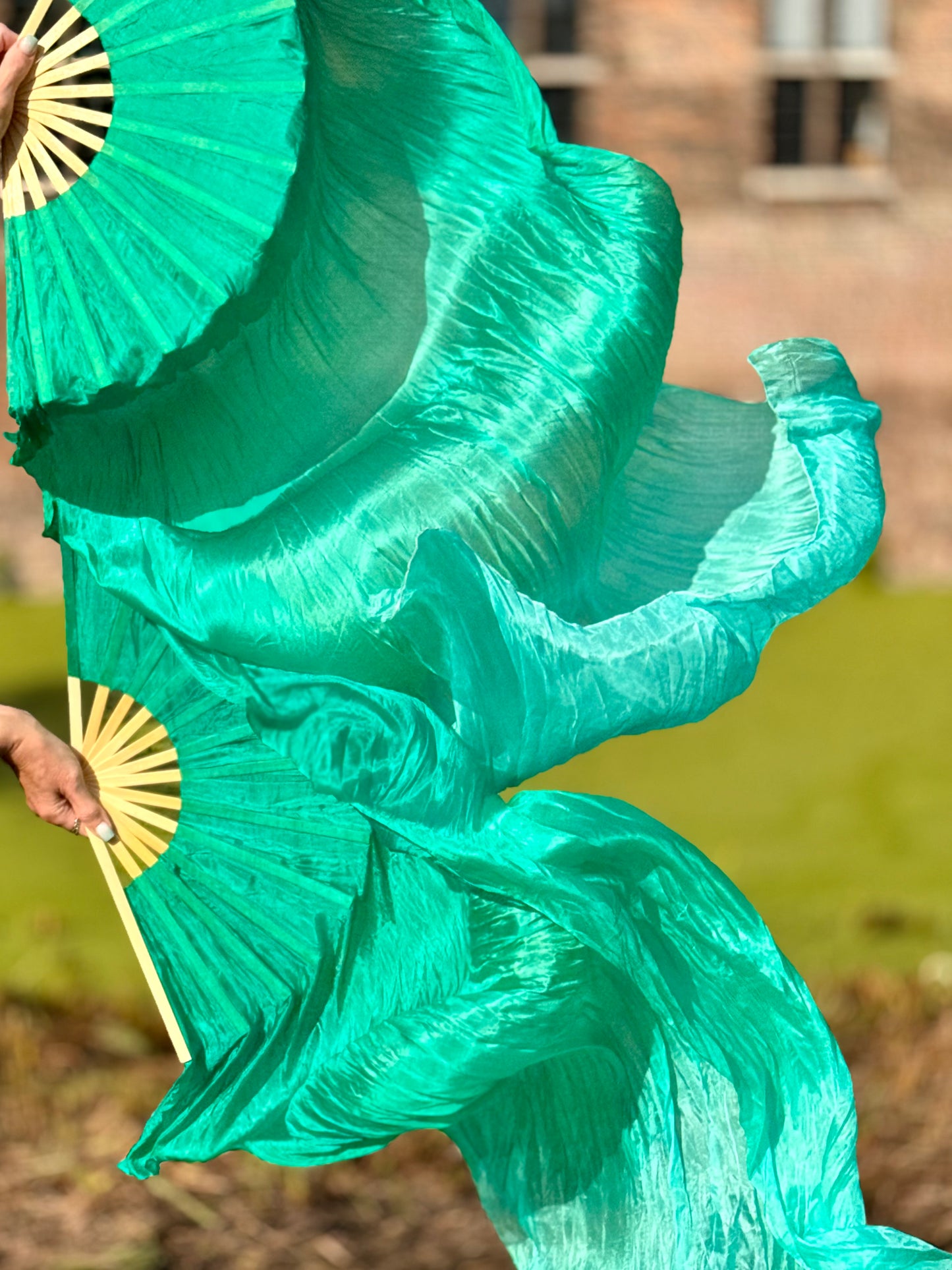 Silk fanveils set in peacock green with color gradient